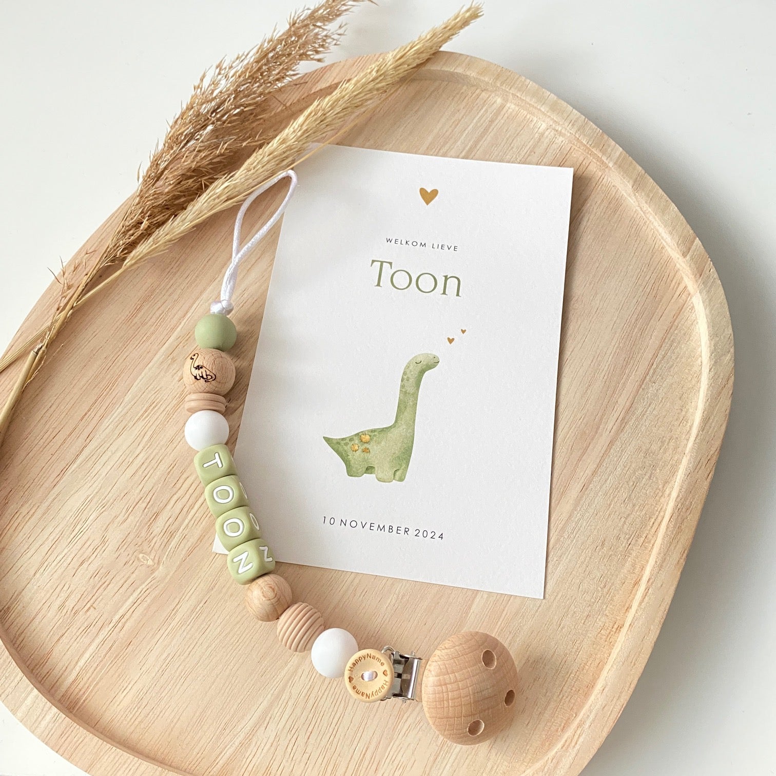 Ontwerp speenkoord in stijl geboortekaartje